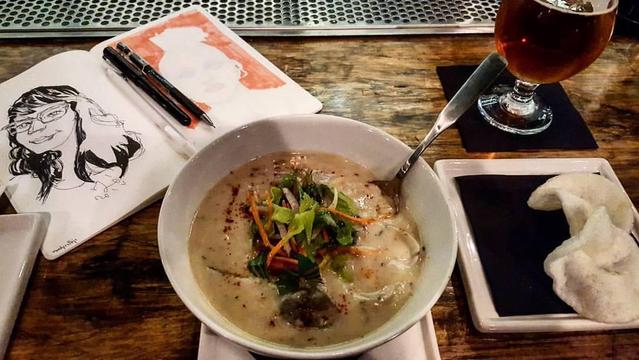 soup bowl, sketchbook with toot description, and a beer