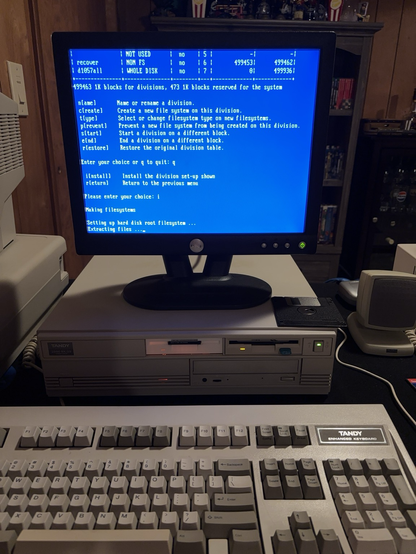 Tandy 2500 SX/25 computer running the installation program for a new operating system.