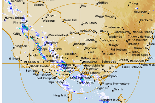 Radar map of Victoria (Australia) showing rain bands heading from west to south east across the state. Fires are burning in the east of the state in addition to central Victoria.