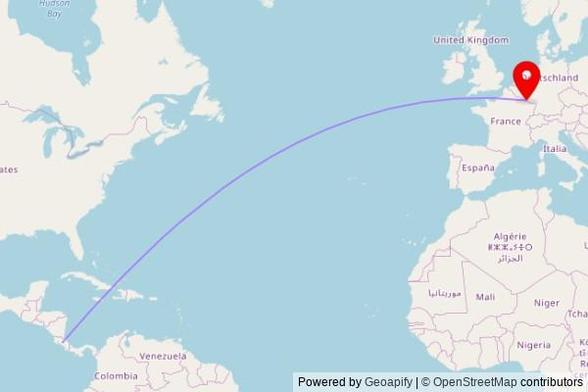 A map showing the great circle route from Santa Ana in Costa Rica to a map pin at Saint-Lambert et Saint-Blaise, Rue de l'Église, 3332 Bettembourg, Luxembourg
