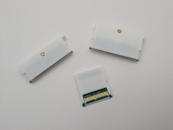 The ds lite gba, ds phat/GBA and DS Lite led carts laid out on a white background 