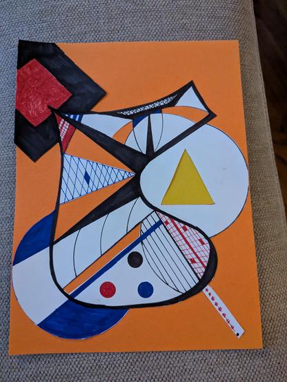 Doodle using black, blue and red sharpie. Cut and put over orange and yellow paper.