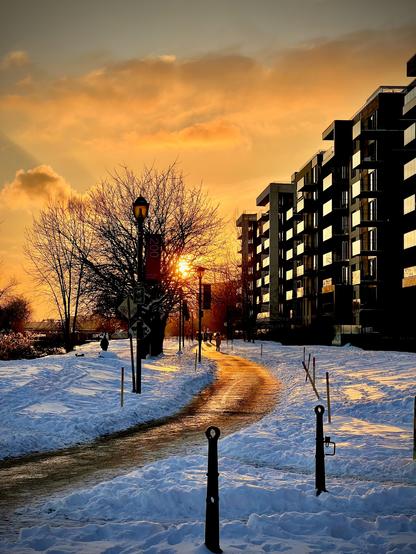 Sunset over the canal Lachine bike path with snow
