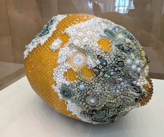 decomposing lemon sculpture composed of gems