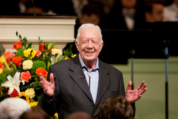 Former President Jimmy Carter teaches a Sunday school class at the Maranatha Baptist Church in his hometown of Plains, Ga., on Aug. 23, 2015. His was a long life well lived as a naval nuclear engineer, farmer, governor, president, mediator, husband, father, grandfather, best-selling author, Habitat for Humanity carpenter and Sunday school teacher, Talmage Boston writes.(David Goldman / AP)