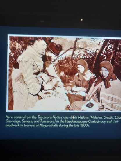 Here women from the #Tuscarora Nation, one of Six Nations (#Mohawk, #Oneida, #Cayusa #Onondaga, Seneca, and Tuscarora) in the #Haudenosaunee Confederacy, sell their beadwork to tourists at Niagara Falls during the late 1800s.