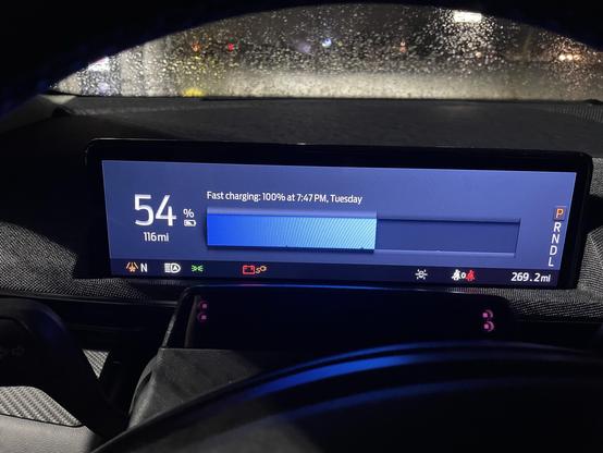 Dashboard showing 54% charge as fast charging continues.