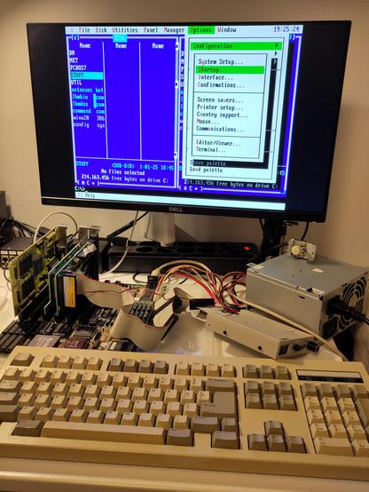 The 486DLC running DOS Navigator 1.51, using a custom Norton Commander-alike color scheme.