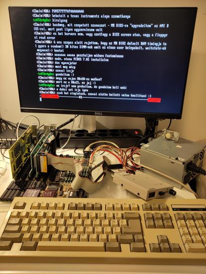 The 486DLC is connected to the internet, running IRCjr from the mTCP package. The IRC chat on the screen is in Hungarian, and talks about the adventures getting the system running and online.
