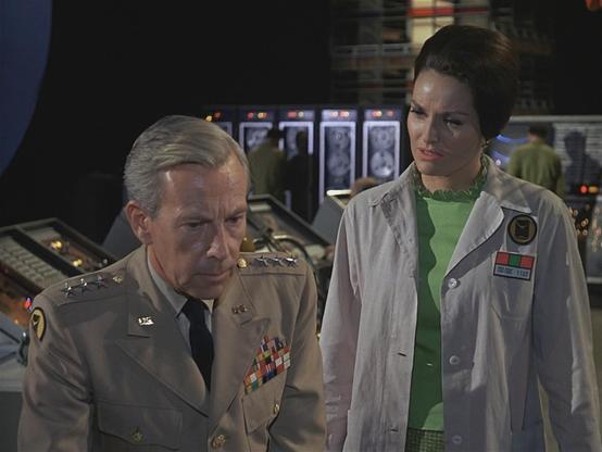 General Kirk (Whit Bissell) and Dr. Ann MacGregor (Lee Meriwether) ponder imminent destruction in The Time Tunnel episode, Raiders from Outer Space.