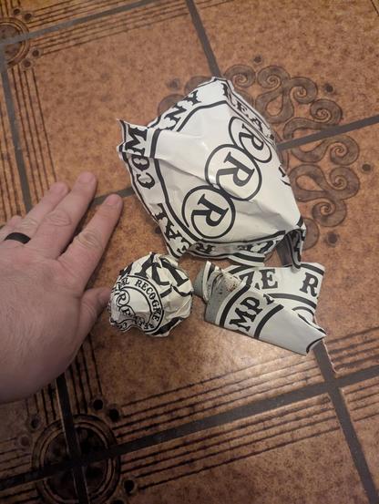 Three wads of sticker trash from a bozo