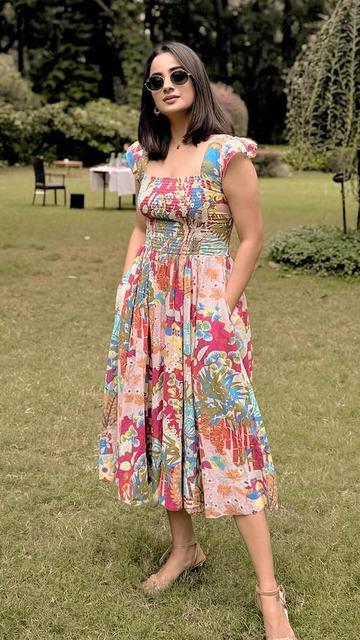 Namitha Pramod elevates festive fashion with her breathtaking floral midi dress. Featuring delicate patterns, vibrant colors, and a flattering fit, this outfit is a must-see for fashion enthusiasts.