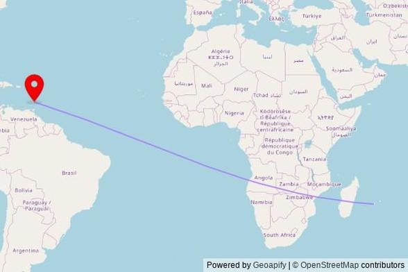 A map showing the great circle route from Saint-Louis in France to a map pin at Mount Moriah Seventh-day Adventist Church, Windward Highway, Ribishi, Saint Vincent and the Grenadines