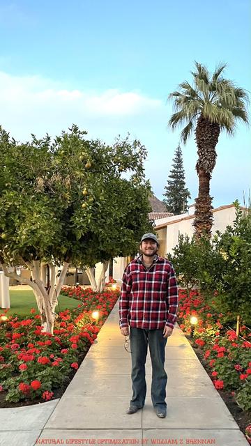 William Z. Brennan in front of Citrus and palm trees, blooming red geraniums, lush winter turf, and the adobe structure of the La Quinta Resort in La Quinta, California, which is a 1920s spanish colonial bungalow resort that is now owned by the Waldorf Astoria group.  William Z. Brennan is a natural lifestyle expert, creator of Natural Lifestyle Optimization, and founder of Desert Mountain Apothecary: The Original Desert Apothecary for Mind Body & Spirit.  Natural Lifestyle Optimization is the philosophy of creating lasting, transformational change through harnessing the power of a natural lifestyle and micro-habits.  Personal development, spiritual healing, spiritual breakthrough, transformational development, transformational breakthrough, breaking free from spiritual bondage, mindfulness, meditation, consciousness, subconscious, spiritual awakening.  Please Enjoy!  All the best, William Z. Brennan