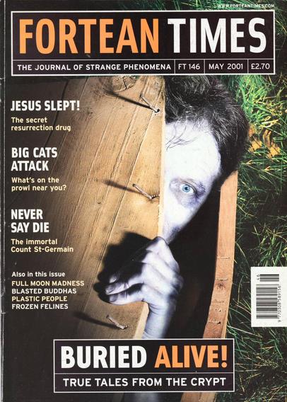 The front cover of Fortean Times: The Journal of Strange Phenomena No 146 for May 2001 which features a photographic representation of a pale head peeking out from within a coffin to illustrate the feature article "Buried Alive: True Tales from the Crypt."