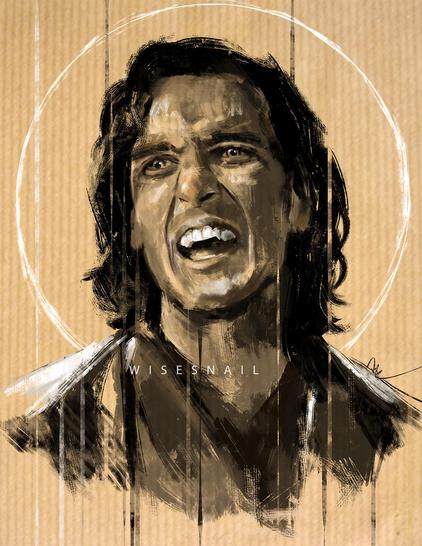 Monochromatic portrait of Assad Zaman as Armand. His mouth is open ad he's showing his fangs. A white halo surrounds his head. 