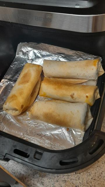 Air fryer pan with four burritos