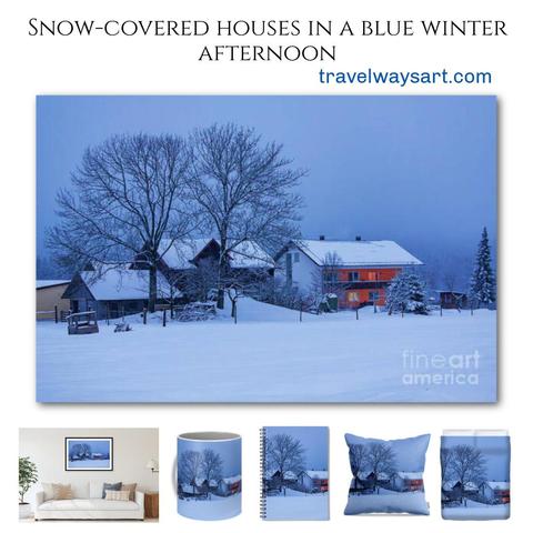 Snow-covered houses in a blue winter afternoon in Fleckl, Bavaria, Germany
