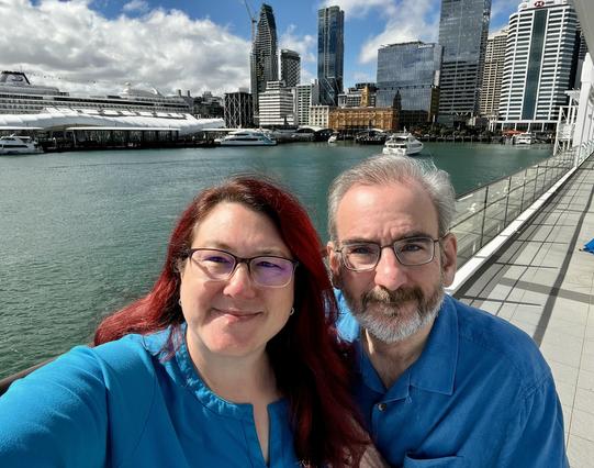 Kris and John with Auckland skyline behind.