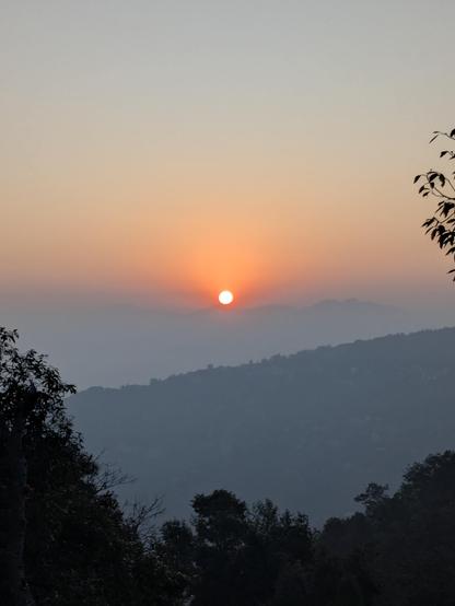 A sun rising at dawn at the background 