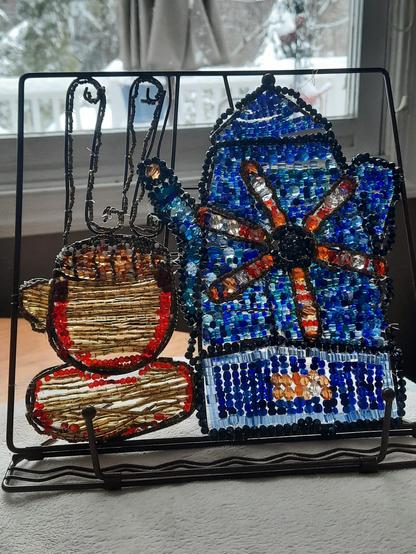 Beaded tabletop book rest, featuring a coffee pot and cup.