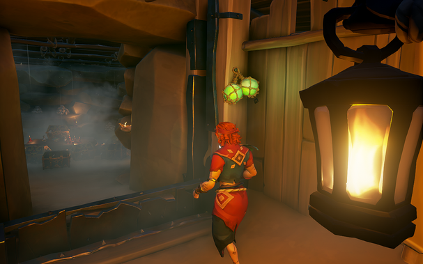 A pirate with red hair and wearing blue and magenta clothing moving through a heavy stone archway that leads into a room full of torches and treasure chest. In the foreground a disembodied hand holds a burning lantern.