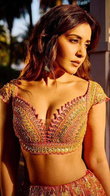 Step into the spotlight like Raashi Khanna in her breathtaking pink lehenga. Perfect for brides who want a mix of tradition and glamour, this outfit is adorned with intricate details and a flawless design. Whether it's a wedding or a grand occasion, this lehenga sets the ultimate style statement.