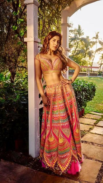 Inspired by Raashi Khanna’s stunning pink lehenga? This bridal outfit captures the essence of timeless beauty with intricate detailing and a flattering fit. Perfect for weddings, it’s a look that speaks of elegance and charm.