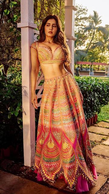 Raashi Khanna redefines bridal fashion with her ethereal pink lehenga. Designed for modern brides, the outfit features exquisite embroidery and a captivating color that’s sure to steal the show. Take your wedding look to the next level with this dreamy inspiration.