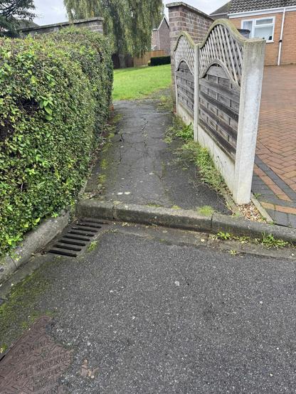 The end of a path joining a road with a large step (no pavement). 
