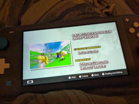 Nintendo switch lite showing the end credits for mario sunshine 