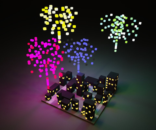 **TL;DR:** A colorful voxel-style cityscape with fireworks in the sky in yellow, pink, blue, and green.

**Description:** The image shows a blocky, voxel-style city with dark buildings lit by yellow square windows, creating a nighttime scene. Above the city, vibrant pixel-like fireworks burst in the sky in different colors—yellow, pink, blue, and green. The dark background contrasts with the colorful lights, giving a festive, celebratory atmosphere. The scene looks digital or game-like, resembling 3D pixel art.