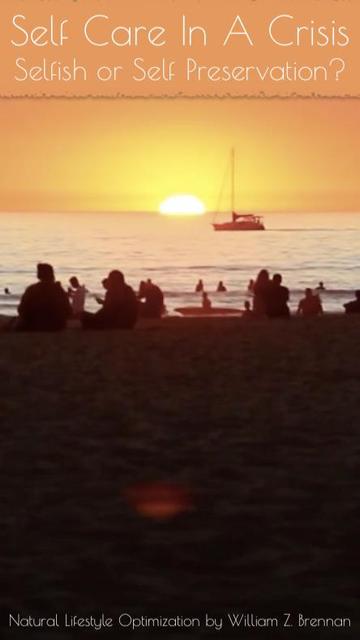 Venice Beach, Los Angeles, Southern California during the Malibu Wildfires of 2019, the sun is setting through a haze of orange and red smoke while the beach is full of people sitting and watching it and breathing in a ton of smoke.  