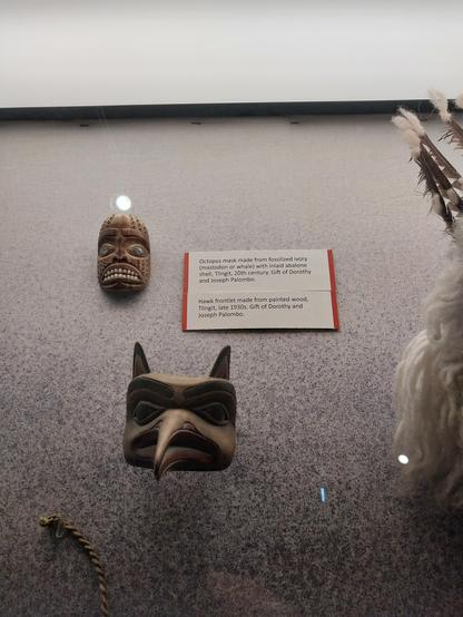 Octopus mask made from fossilized ivory (mastodon or whale) with inlaid abalone shell, Tlingit, 20th century. Gift of Dorothy and Joseph Palombo.

Hawk frontlet made from painted wood, #Tlingit, late 1930s. Gift of Dorothy and Joseph Palombo.