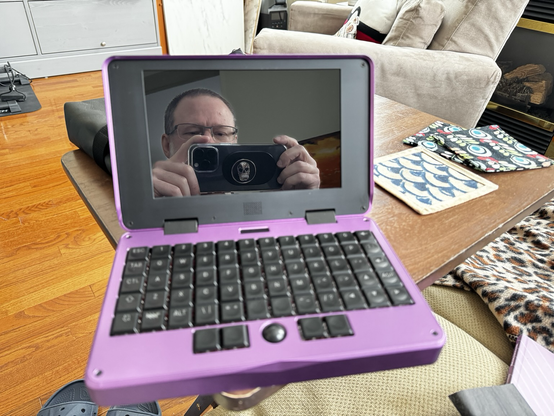 Purple MNT Pocket Reform, open with reflection of photographer in the screen.