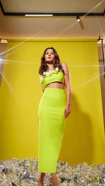 Nikita Dutta shines in a neon yellow dress that’s perfect for the summer season! The vibrant shade captures the essence of sunny days while the sleek silhouette adds a touch of elegance. Paired with subtle accessories, this look proves that neon isn’t just a trend—it’s a statement. Step up your summer style with bold and radiant colors inspired by Nikita’s effortless fashion sense.