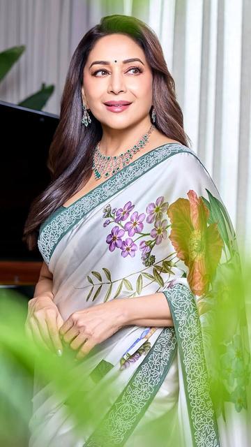 Grace and sophistication met art as Madhuri Dixit chose Aisha Rao’s white floral saree for the PNG Jewellers event. The ensemble’s intricate floral detailing complemented her radiant aura perfectly.