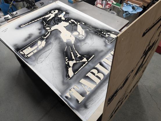 A huge spray paint stencil of a "Marauder" mech from old school Battletech.