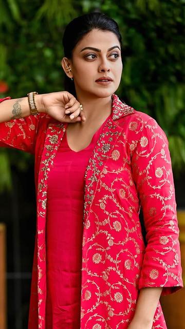 Anusree Nair proves why she’s a fashion icon in a striking red designer dress. With its sleek silhouette and intricate detailing, this dress perfectly highlights her graceful presence. Bold, beautiful, and undeniably chic, this look is pure perfection.