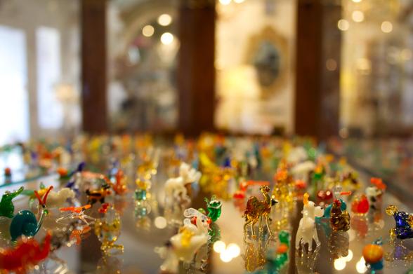 Dozens of tiny glass figurines in a display stand in New Paltz, New York in 2006