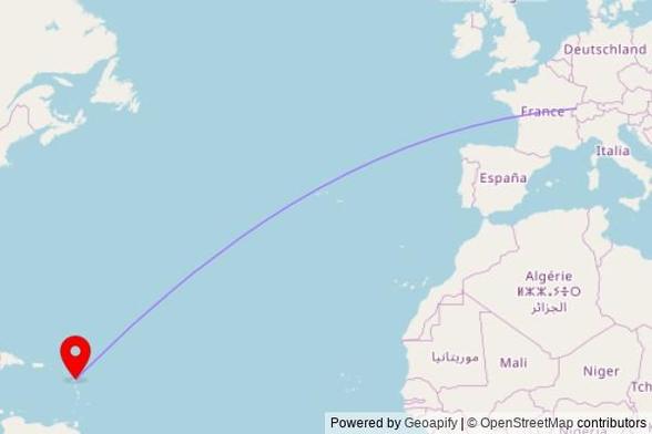 A map showing the great circle route from Villers-le-Lac in France to a map pin at Église Saint-André, Ipasse du Père Buisson, 97111 Morne-à-l'Eau, France