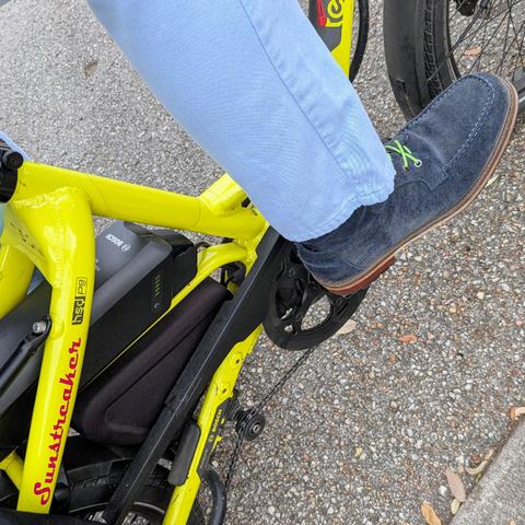 A photo of my right foot on the pedal of a 

yellow Tern HSD cargo bike with its name, Sunstreaker, in red on the seat stay

I'm wearing

Blue suede moc toe boots with lime green laces under a sky blue pantleg
