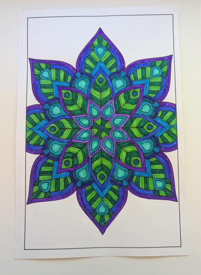 Image shows a fully colored coloring page in various shades of blue, purple, and green