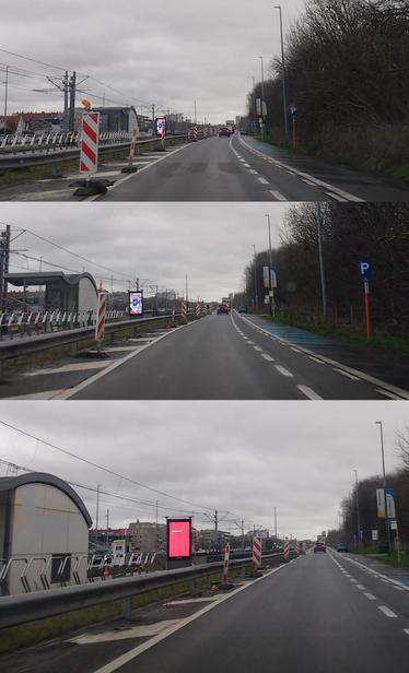 Reclamescherm naast de baan, duidelijk gericht op chauffeurs