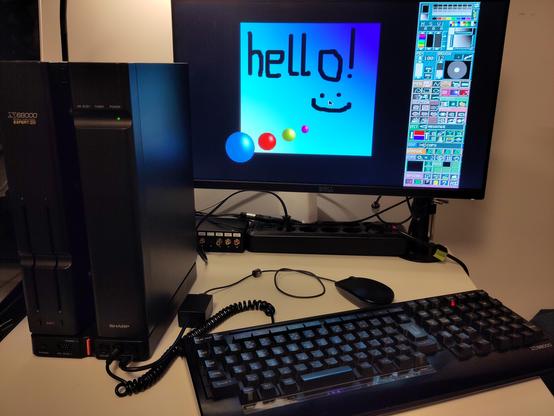 The X68000 assembled, to test the adapter if it survived moving it into a case. It did. The X68000 is running a Paint app (Matier) that shows "Hello! :)" written on the screen with the mouse, with a colorful background.