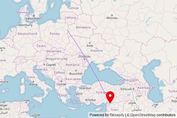 A map showing the great circle route from Białystok in Poland to a map pin at مسجد عمر بن الخطاب, شارع ابو العتاهية, Azaz, Syria
