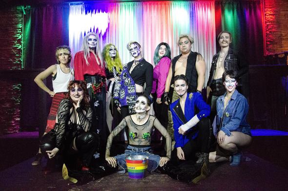 A group photo onstage from the end of the last Willow's Wild Things. The performers in the back row, from left to right, are Austin Tacious, Theo Rhetical Satanix, Heathen, Lavender Flame, Percy Pegg, and Doobie Howser. In the front row, from left to right again, the performers are Lemon X, Willow Child, Androgynass, and Robyn Hearts. Believe me when I say these are some of Vancouver's finest, wildest things.