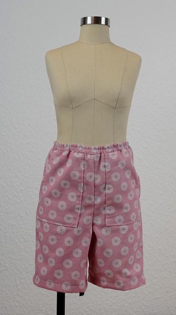 A pair of pink shorts with elasticated waistband and patch pockets