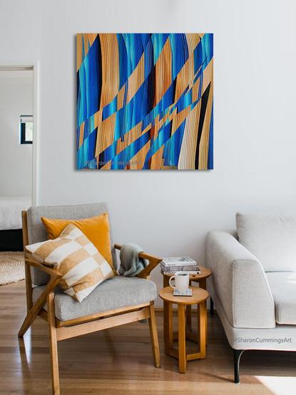 Colorful square abstract in blue and tan and waves of visual texture by artist Sharon Cummings.
