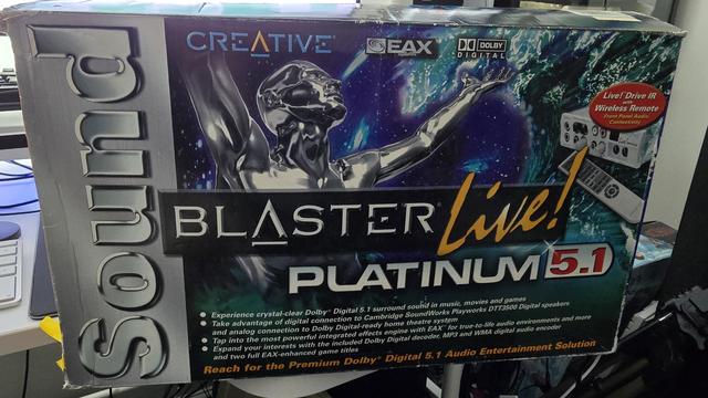 "Creative Sound Blaster Live! Platinum 5.1 packaging. Features include EAX, Dolby Digital support, Live! Drive IR with wireless remote, and front panel audio connectivity. The box highlights digital and analogue connections, Dolby Digital-ready home theatre compatibility, and EAX-enhanced game support."